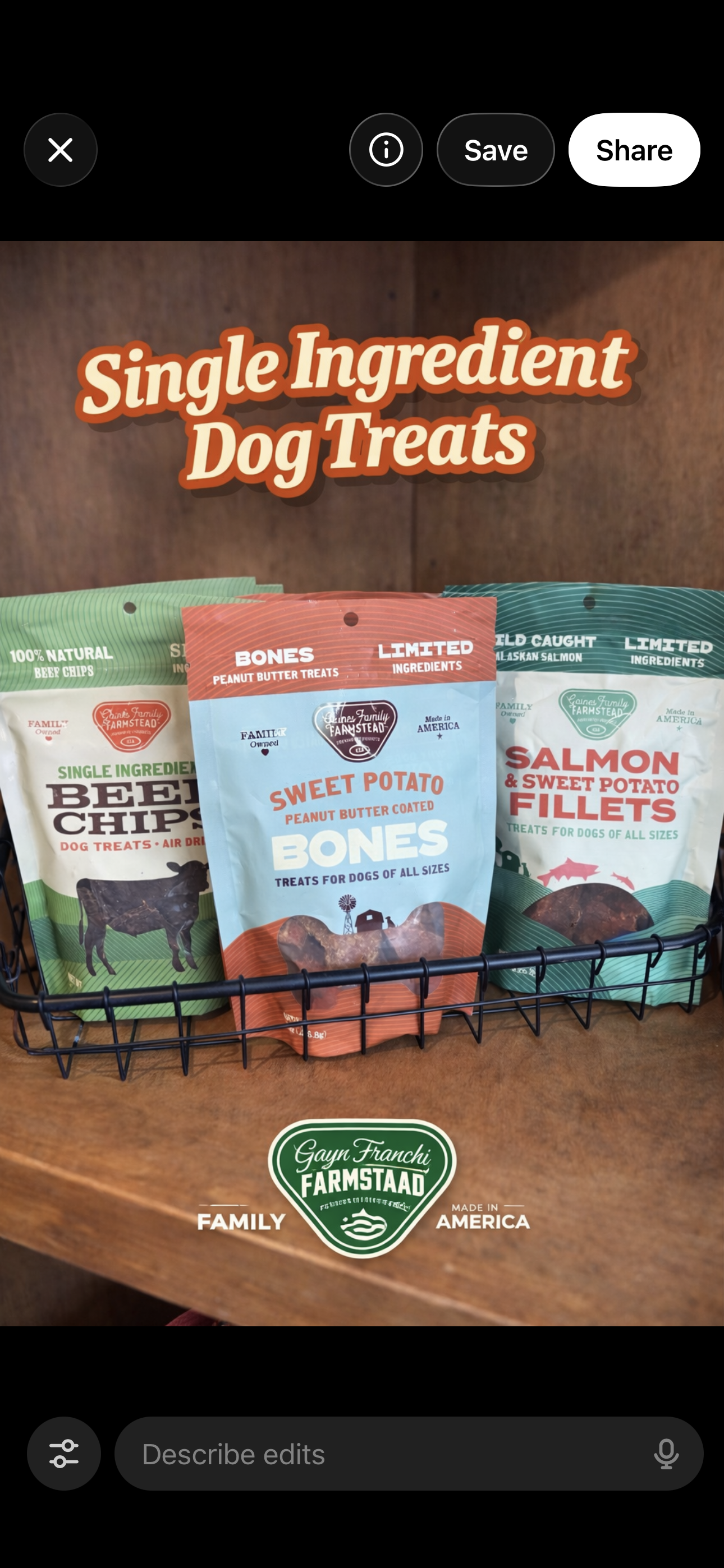 A display of single-ingredient dog treats in a wire basket, featuring packages for beef chips, peanut butter bones, and salmon and sweet potato fillets, with a Gayn Franchi Farmstaad logo.