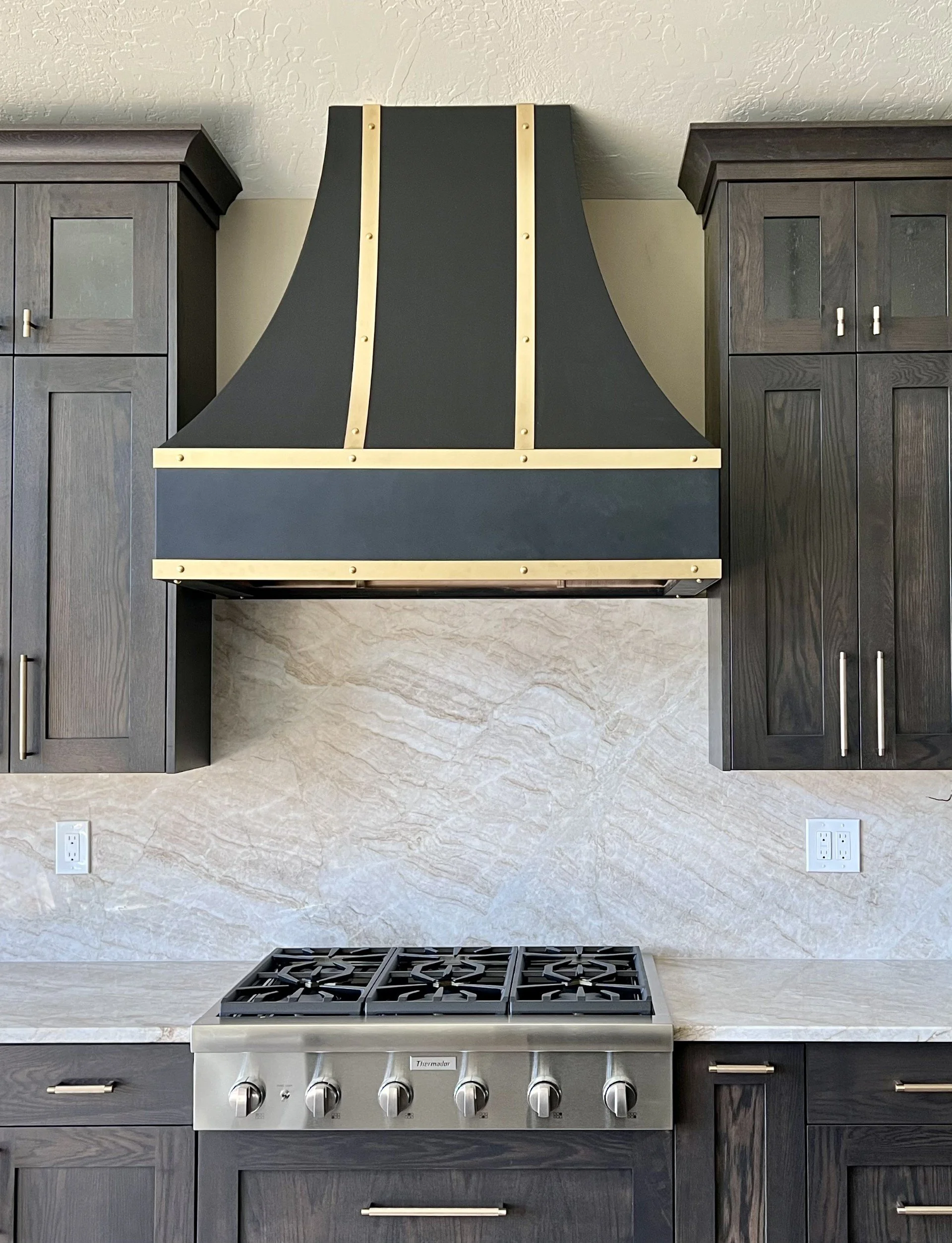 Black powder coat with brass accents.