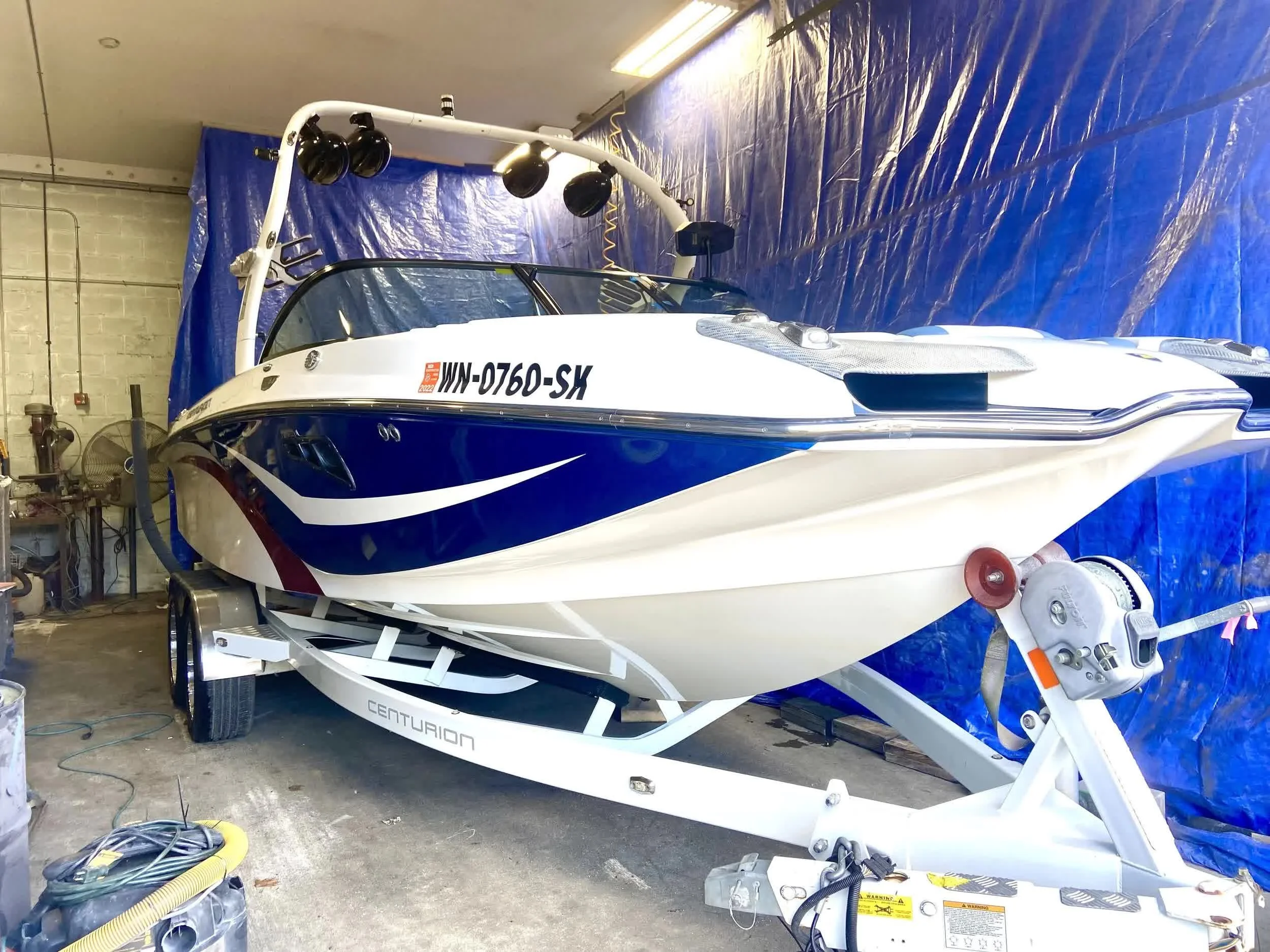 Finished boat detailing on the Eastside with polished hull and clean gelcoat