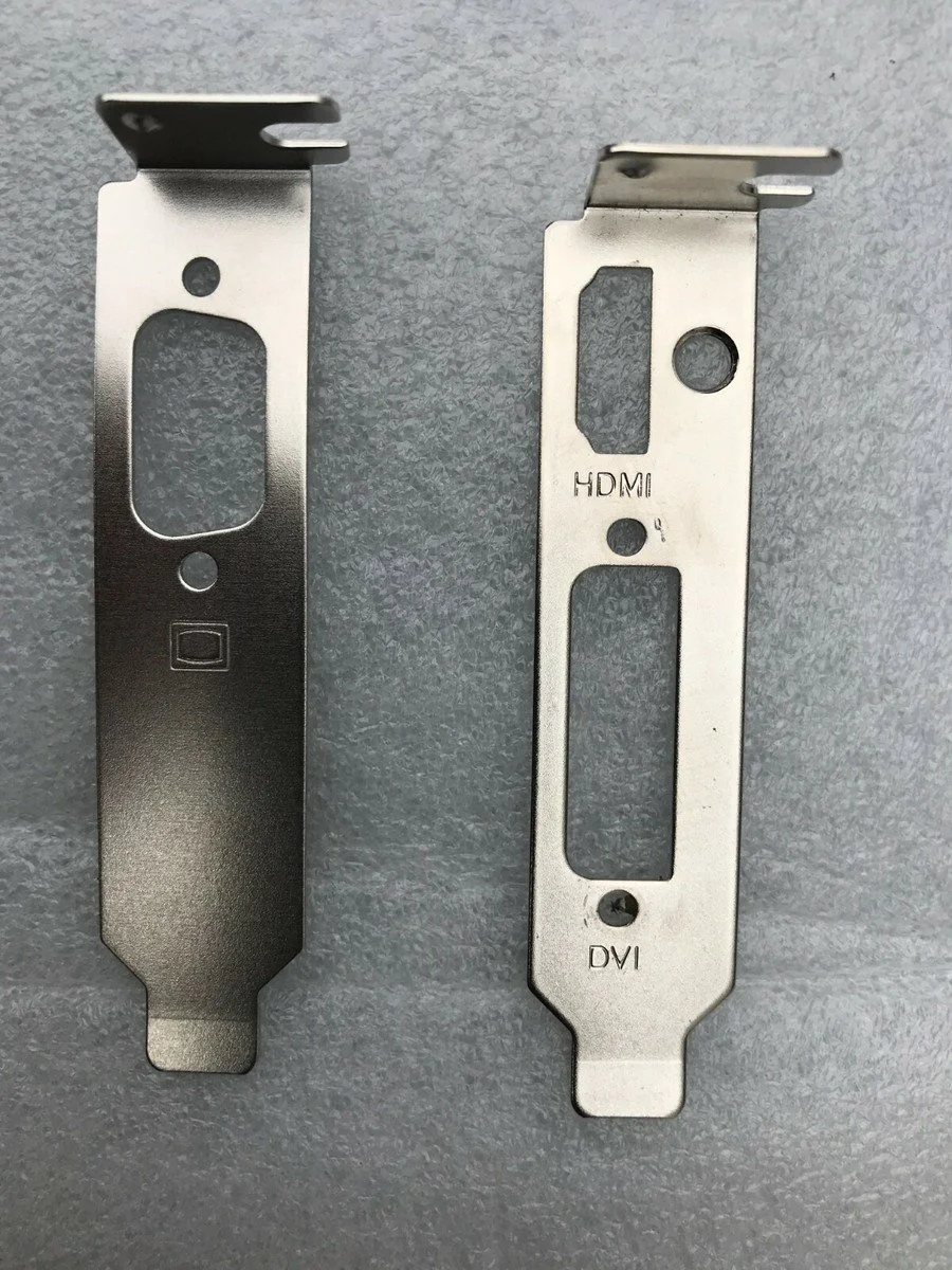 Two metal mounting brackets, one labeled HDMI and DVI, used for connecting display cables to a computer or monitor.