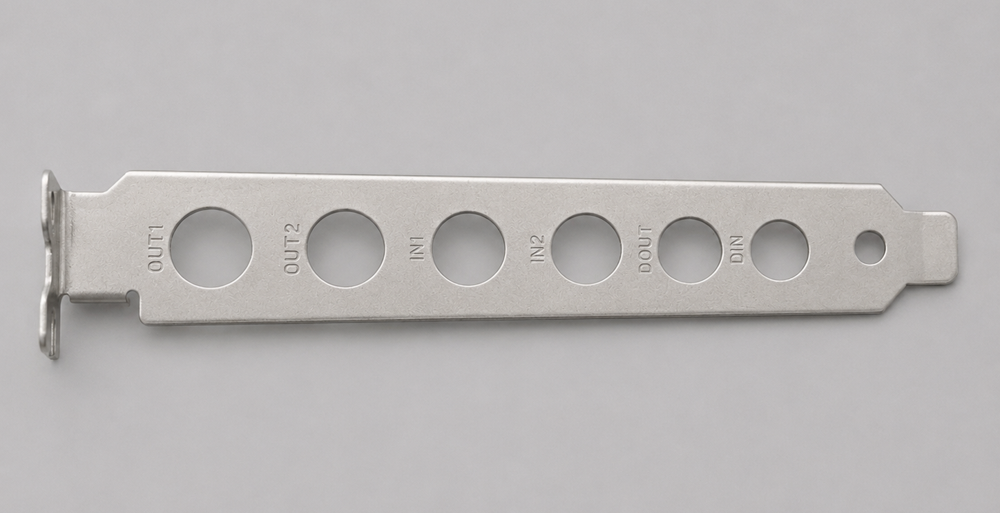 A metallic strip with labeled holes for medical tubing connections, including IN, OUT1, OUT2, DIN.