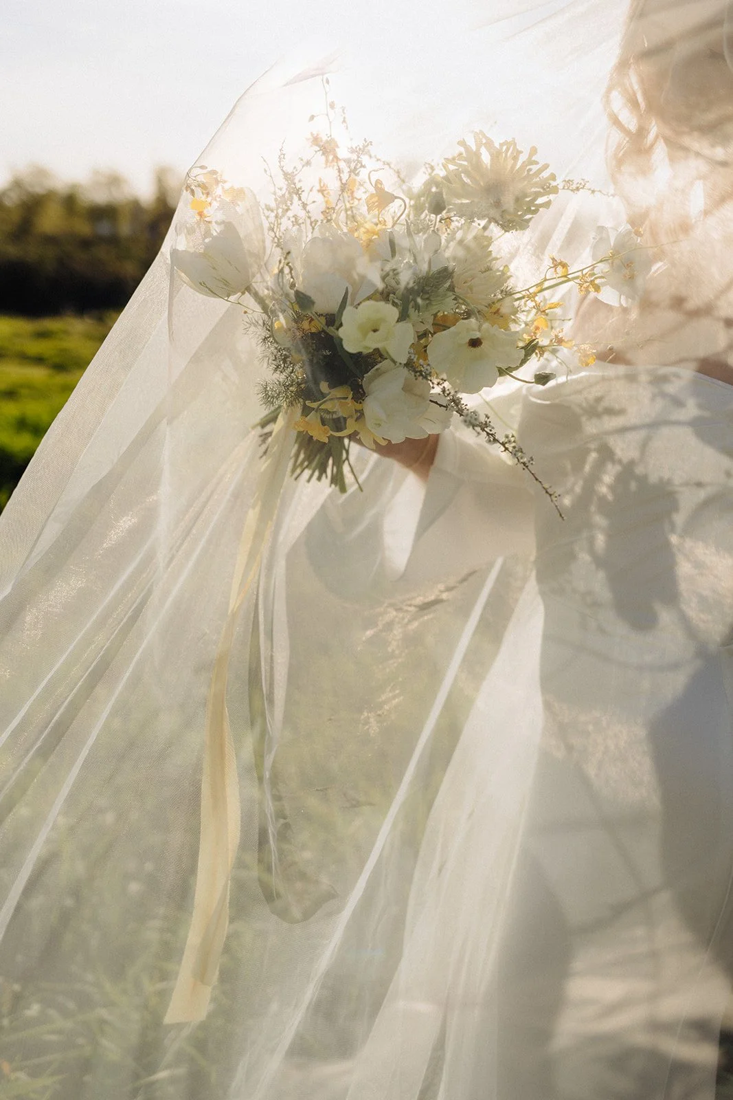 Summer bride bouquet wildflowers during golden hour