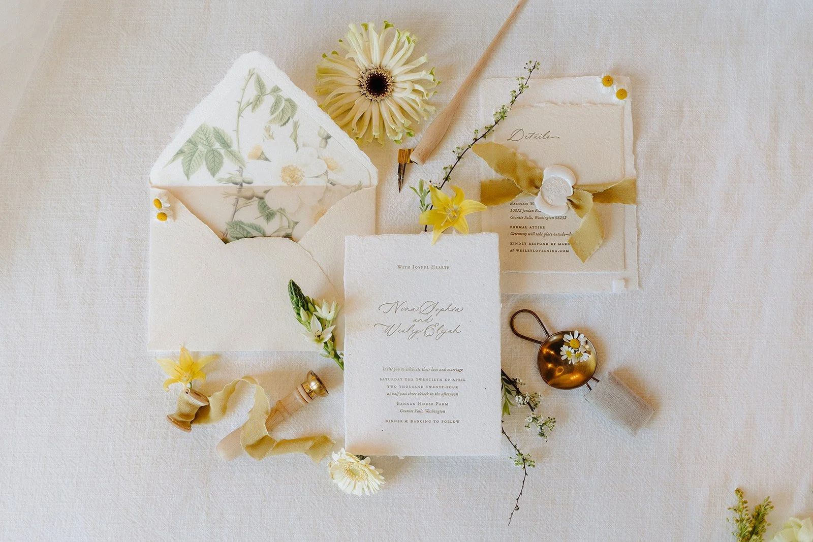 Letterpress wedding invitation on handmade seed paper with soft yellow ribbon at Bannan House Farm