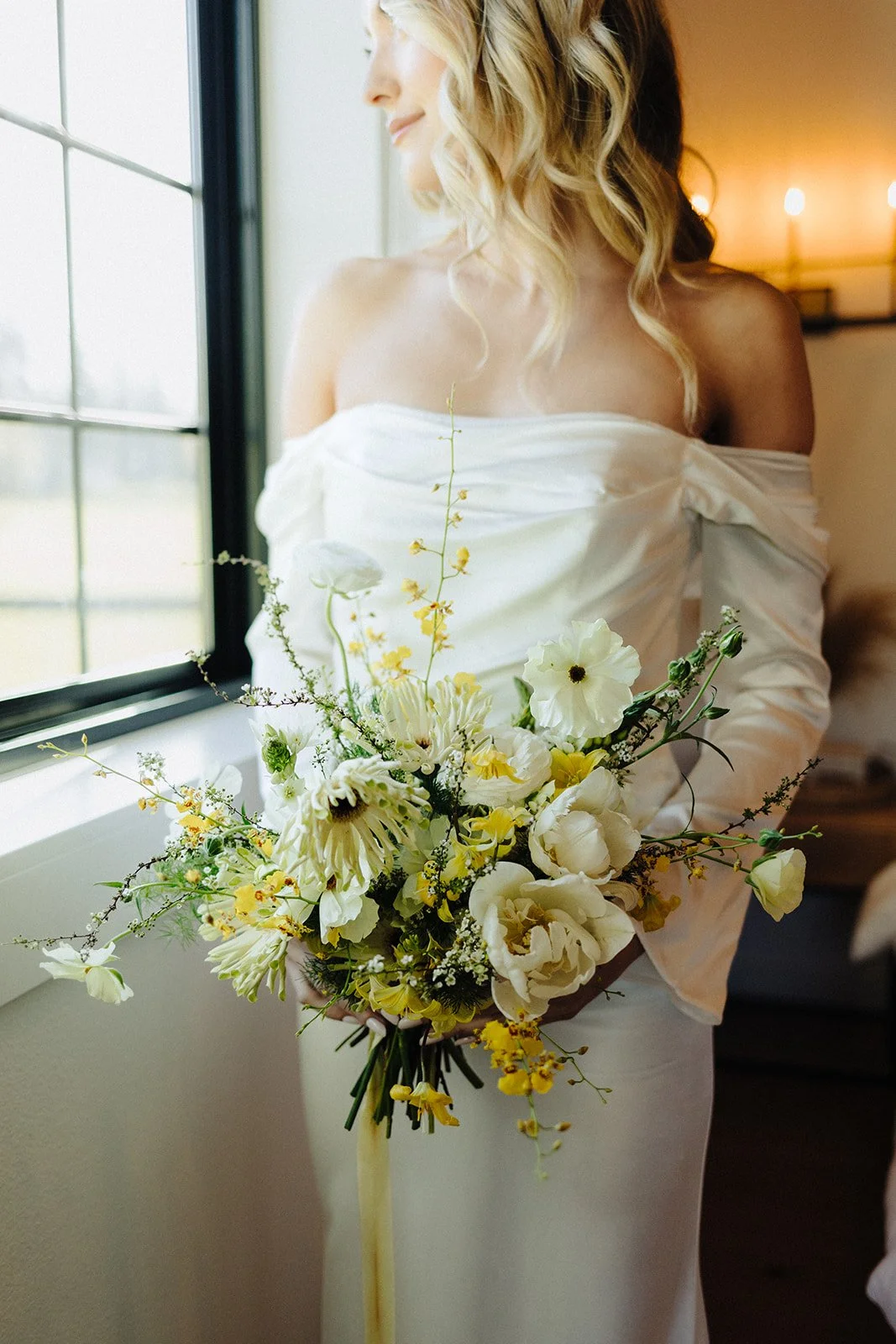 Bridal bouquet with soft yellow and white flowers naturally arranged