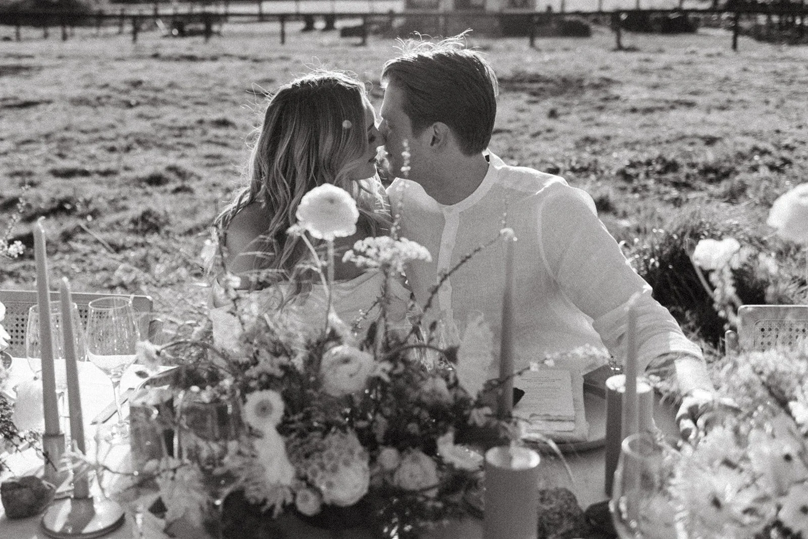 Bride and groom at wedding reception table at Bannan House Farm