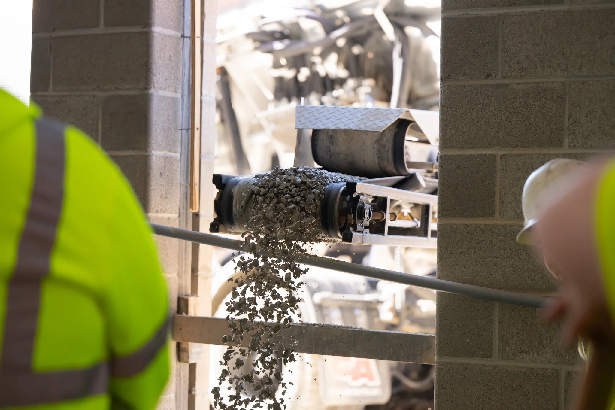 Gravel being slung into a building