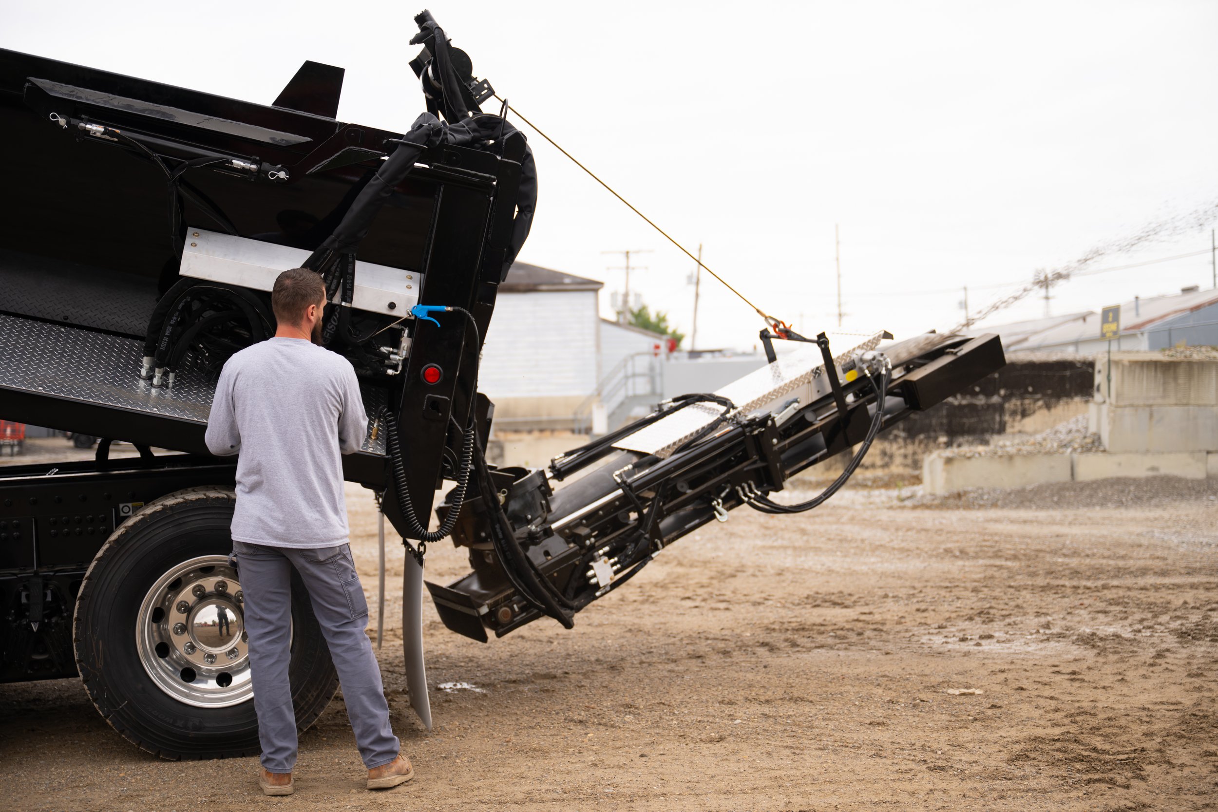 A worker manning the p-shooter on a truck