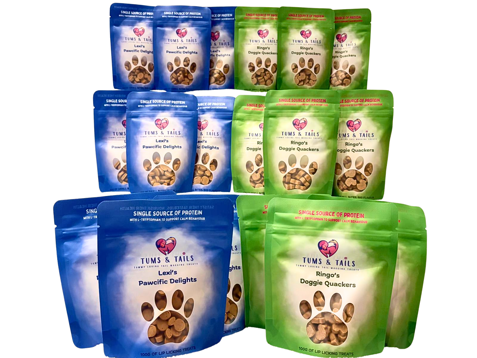 Multiple packets of dog treats in blue and green packaging from Tums & Tails, labeled 'Lexi's Pawfic Delights' and 'Ringo's Doggie Quackers,' featuring paw print designs.