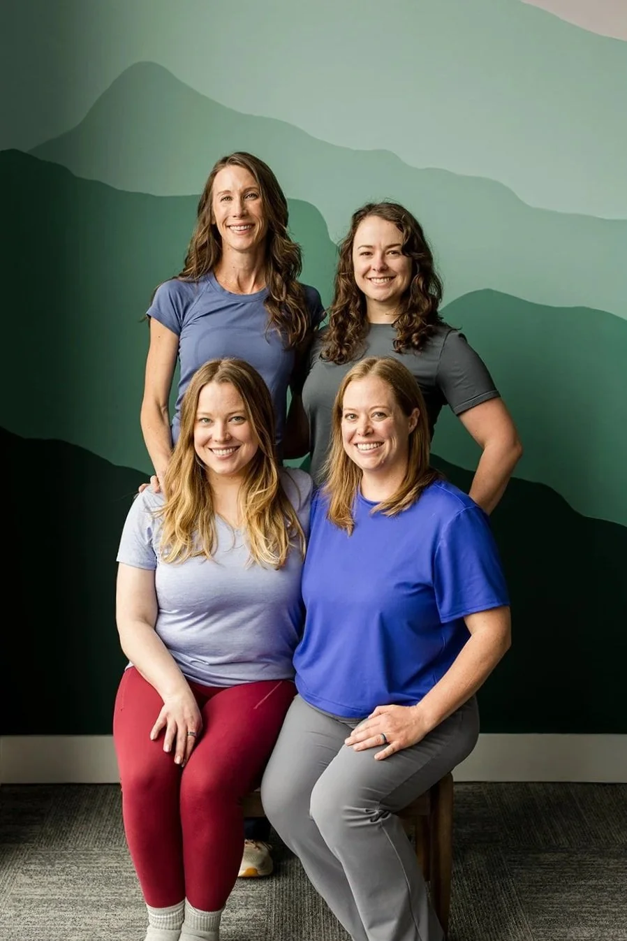 four women; pilates instructors; group head shot
