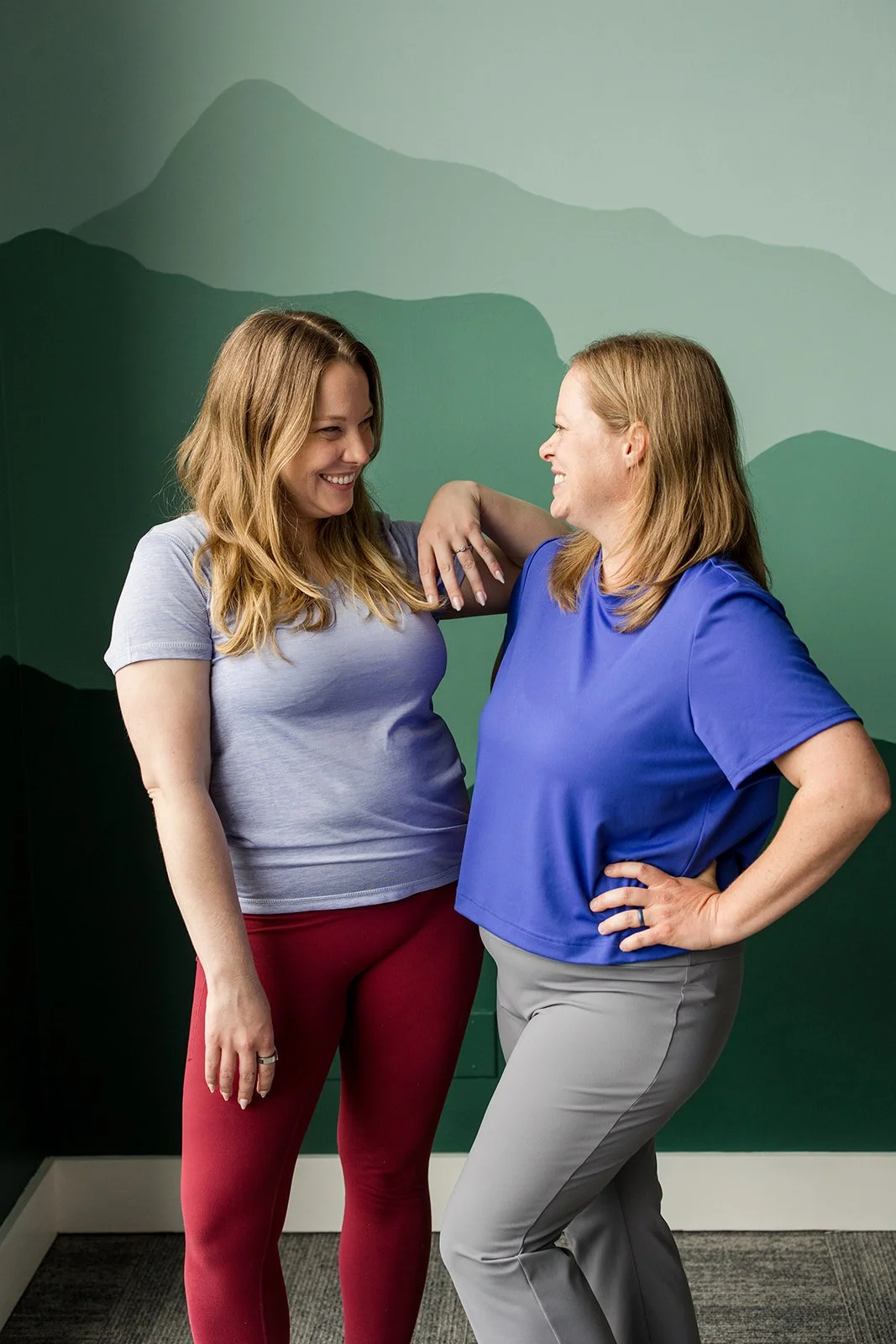 two sisters laughing together