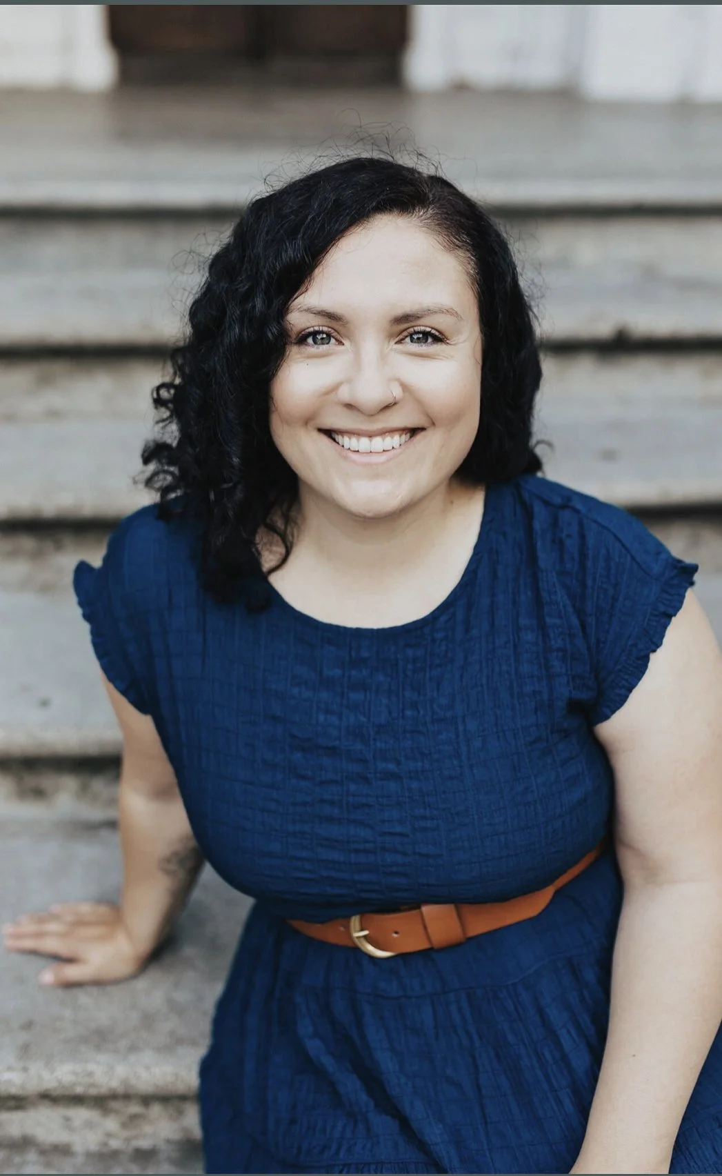 Woman therapist that is warm, inviting, and compassionate.