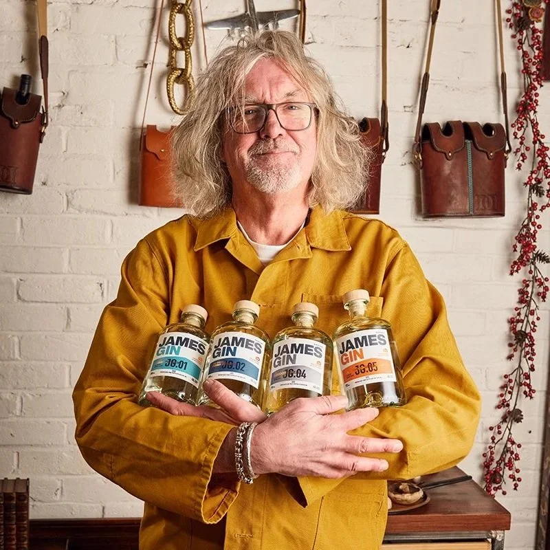 James May holding four bottles of James Gin