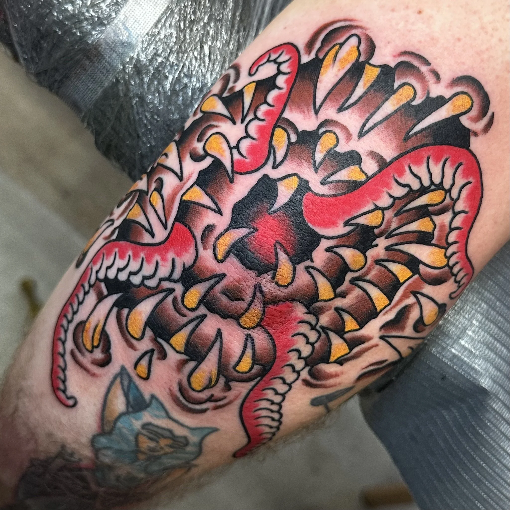 Elbow tattoo by traditional tattoo artist Jeff Young in San Diego, CA