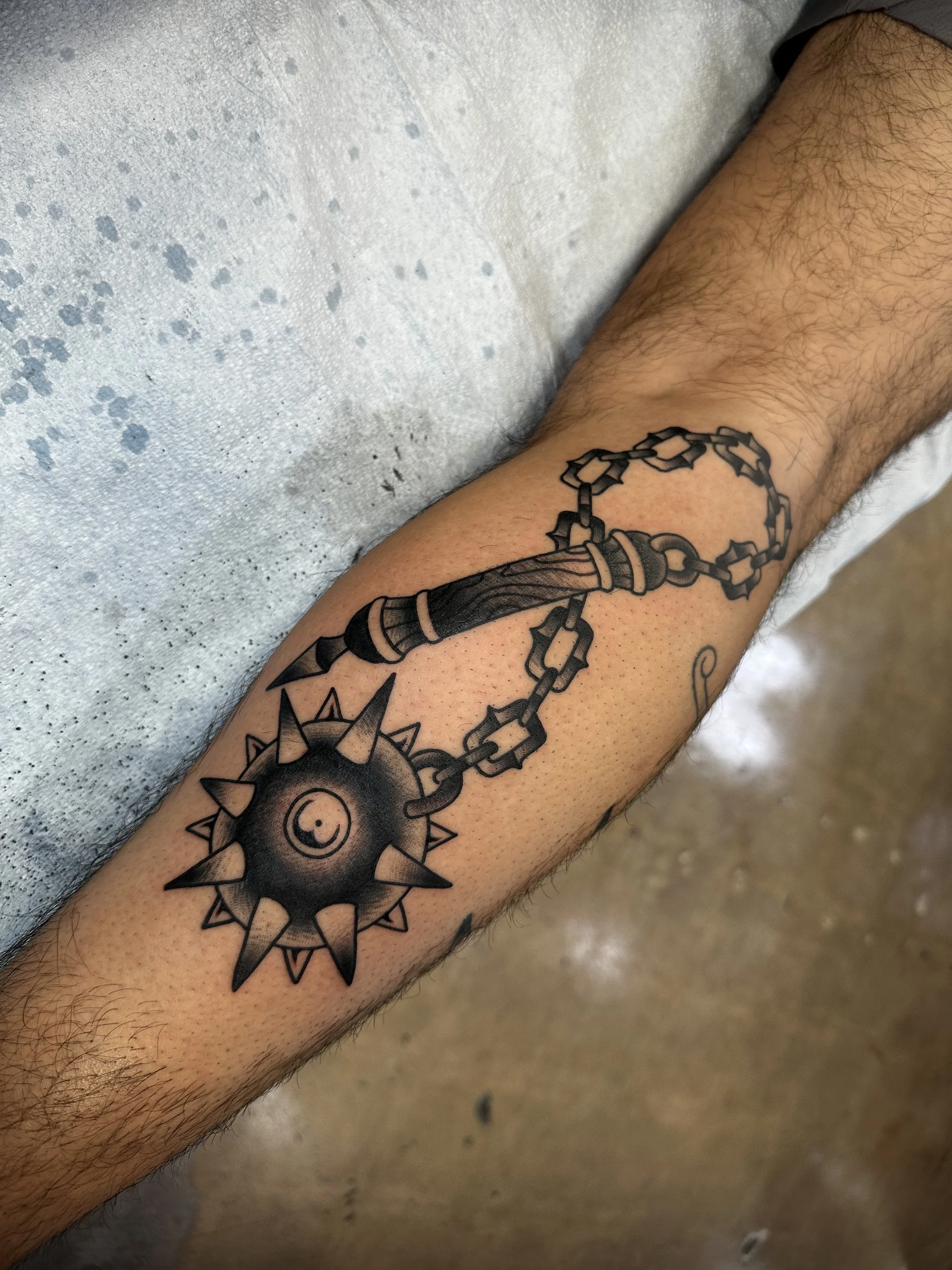 Black and grey traditional tattoo by Jeff Young, traditional tattoo artist in San Diego