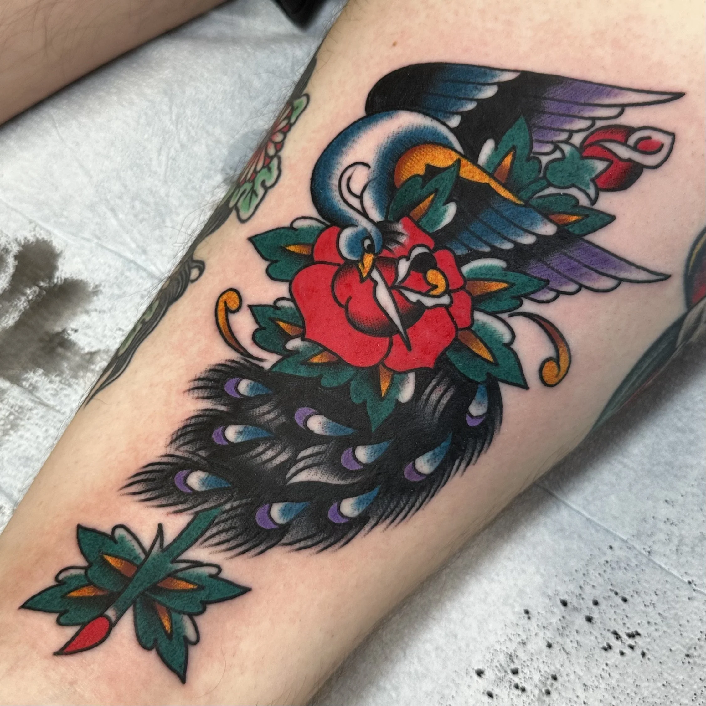 Peacock and Rose tattoo by tattoo artist Jeff 
Young in San Diego