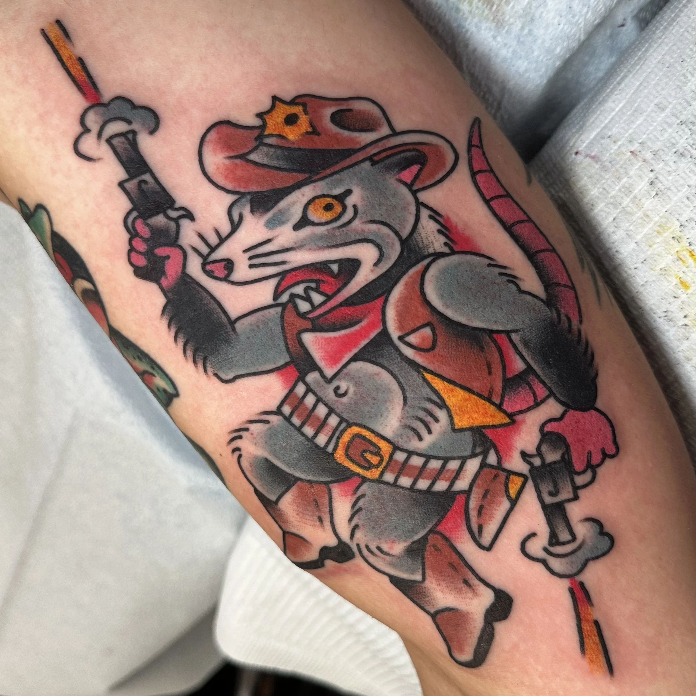 Traditional Possom tattoo by tattoo artist Jeff Young in San Diego, CA