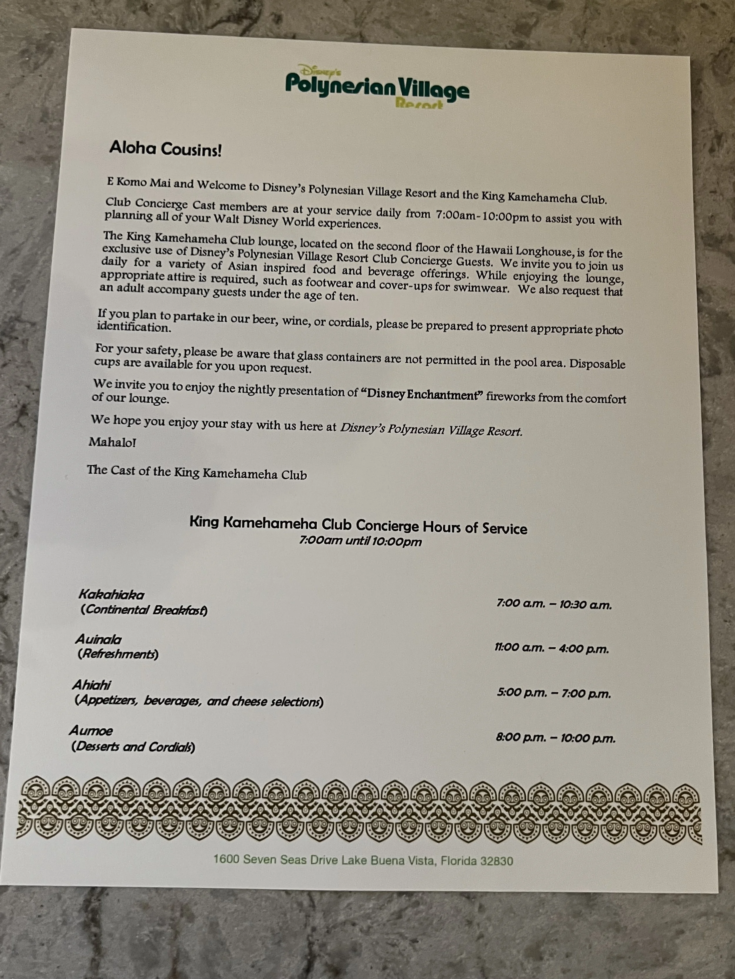 A printed information sheet for Disney's Polynesian Village Resort, detailing the King Kamehameha Club Concierge service hours, dining options, and policies, with a decorative border and the resort's address at the bottom.