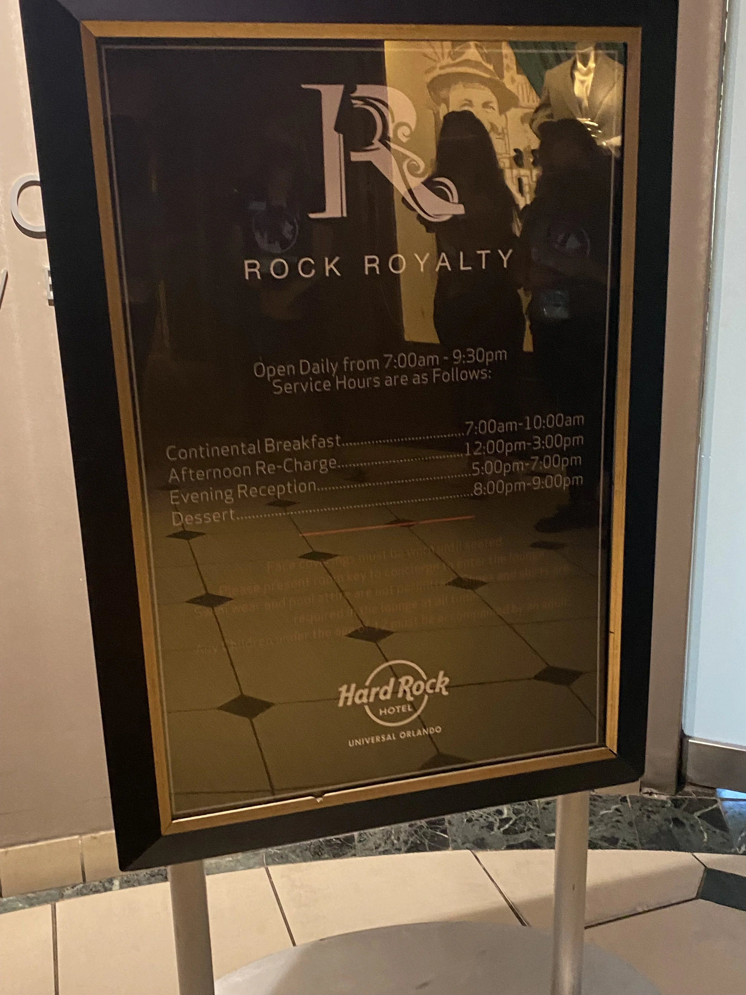 Hotel schedule sign at the Hard Rock Hotel in Universal Orlando, listing service hours and meal times.