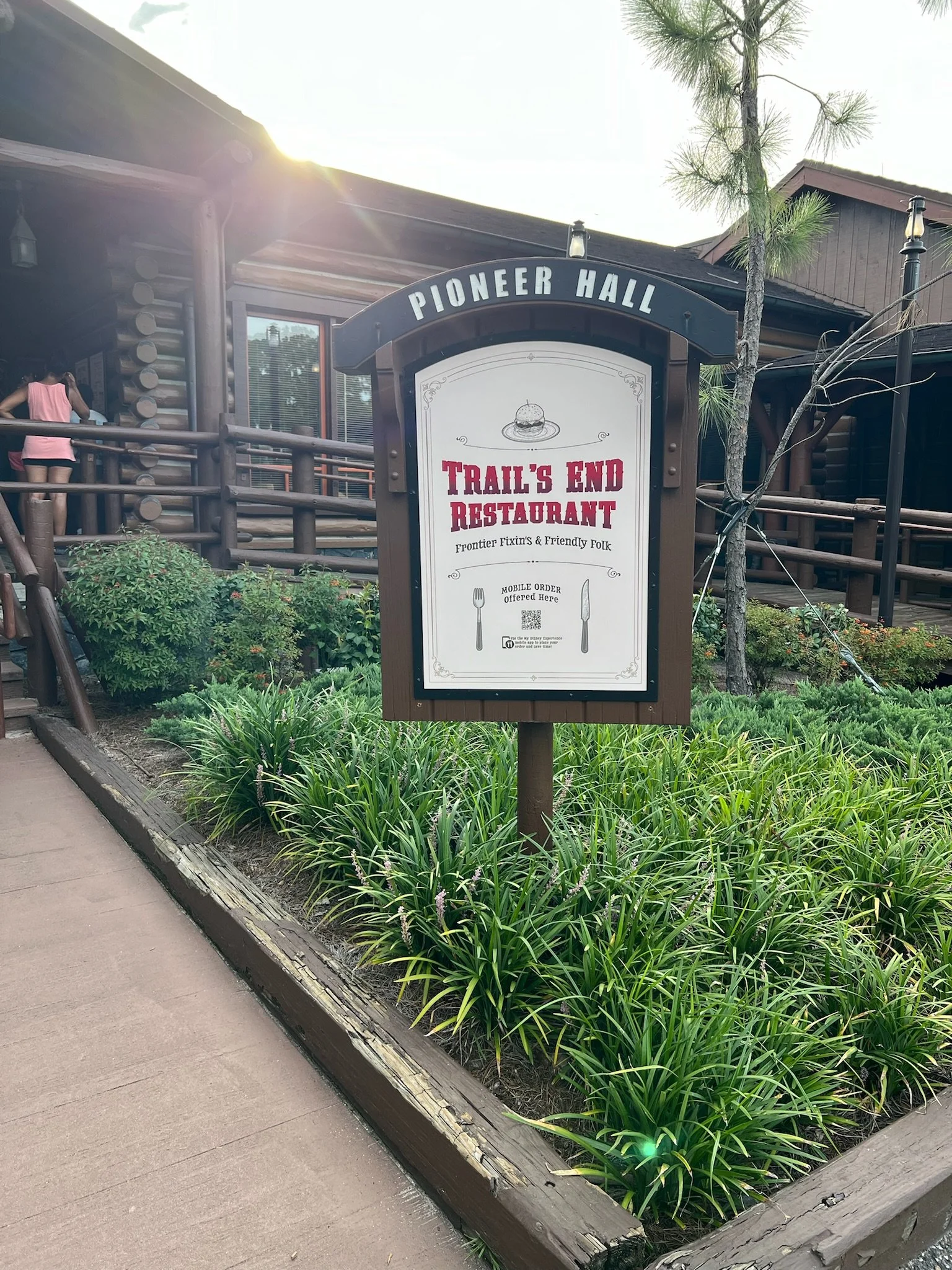 Sign for Trail's End Restaurant at Pioneer Hall, featuring a cowboy hat illustration and mentioning mobile order service.