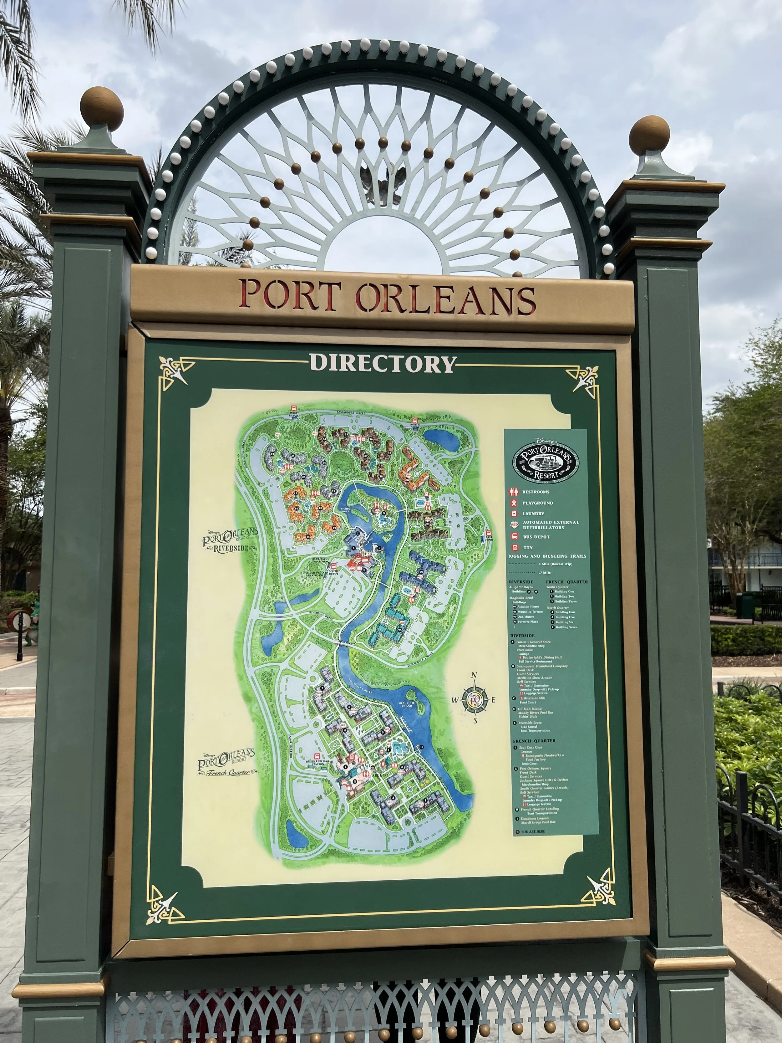 Map of Port Orleans Resort at Walt Disney World, showing various sections and amenities, with a decorative sign at the top.