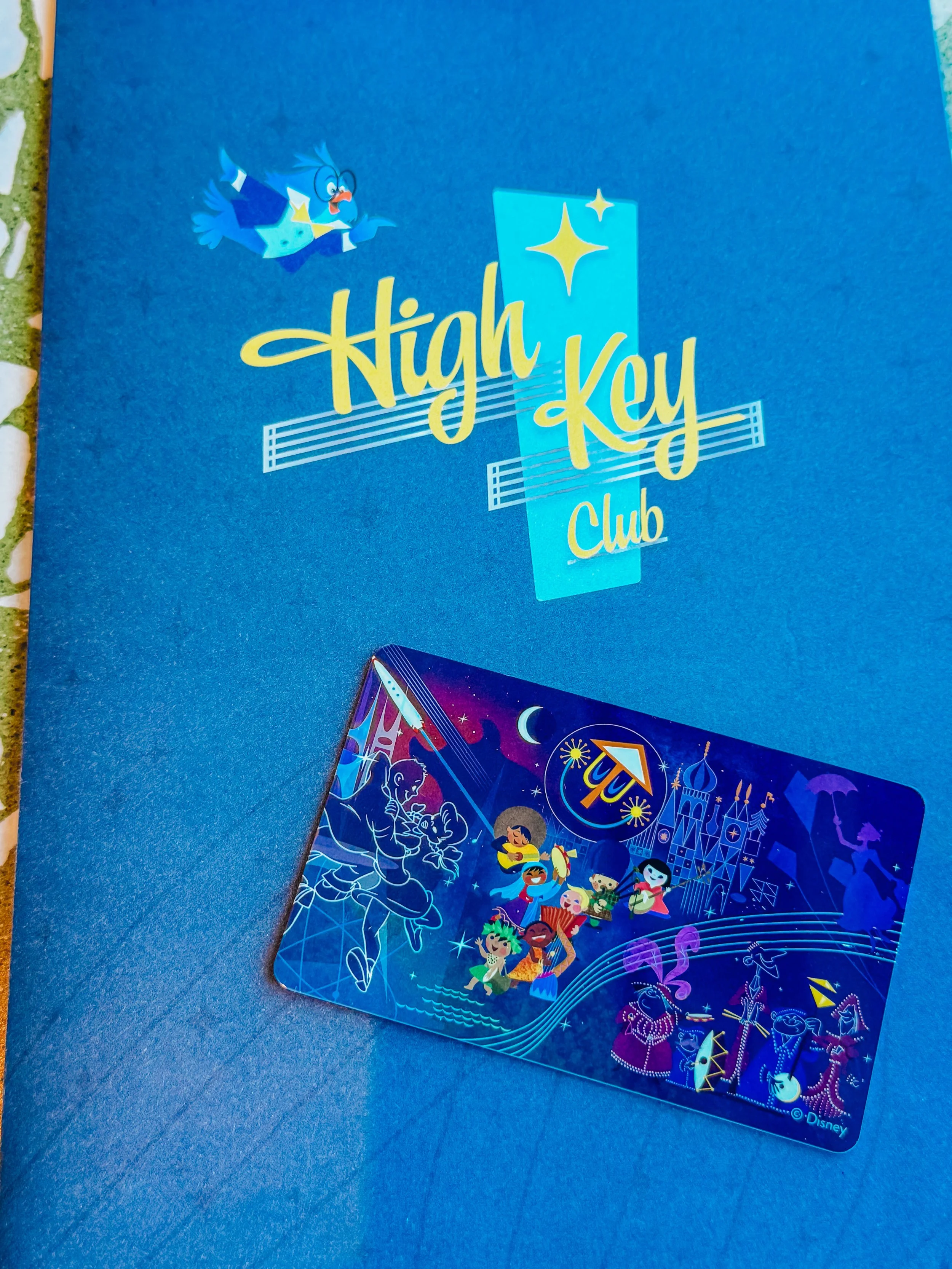 High Key Club promotional card with Disney characters and theme.