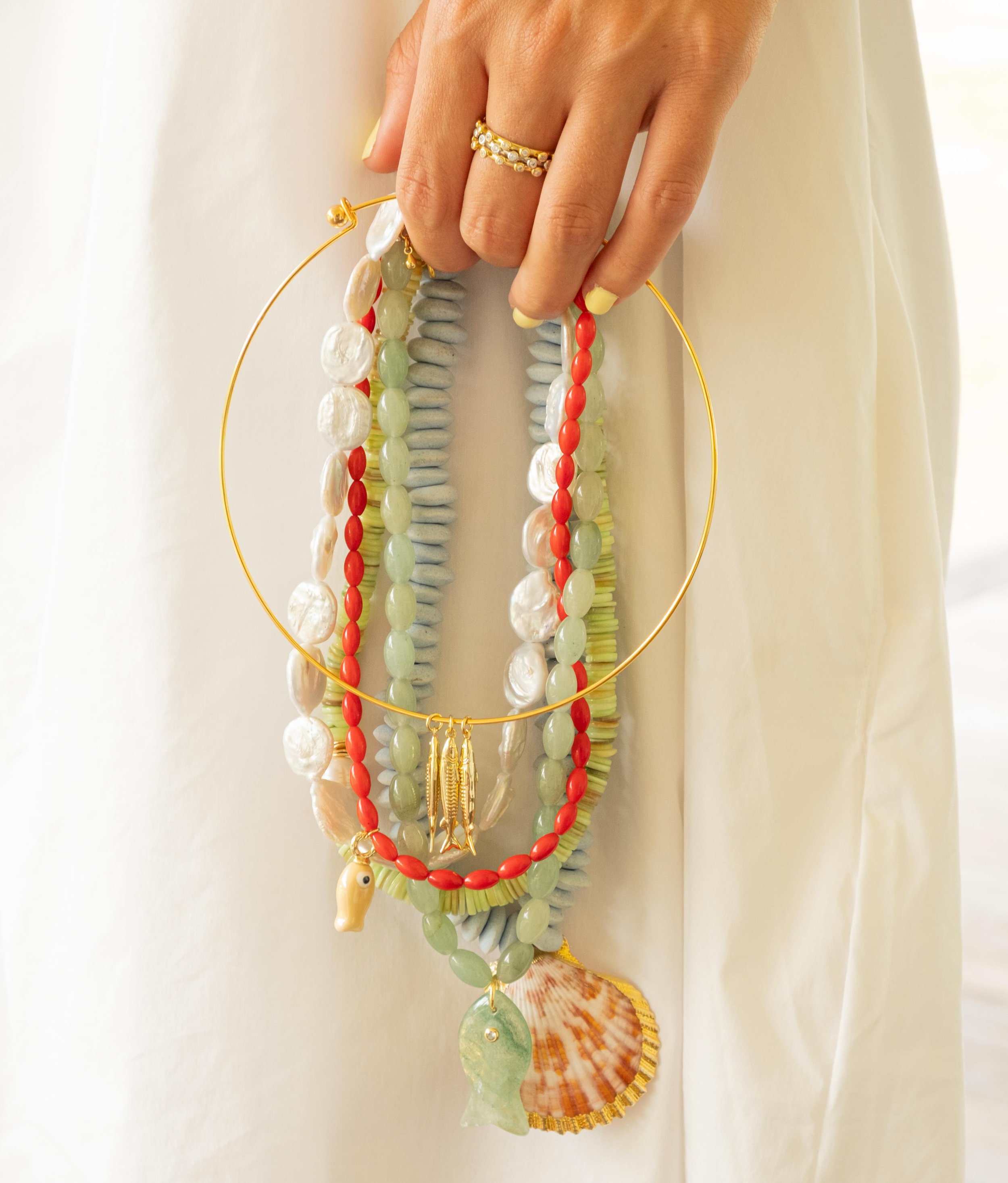 Shells and fish and pearls and more 🐡🐚👙 shop your favorites online now!