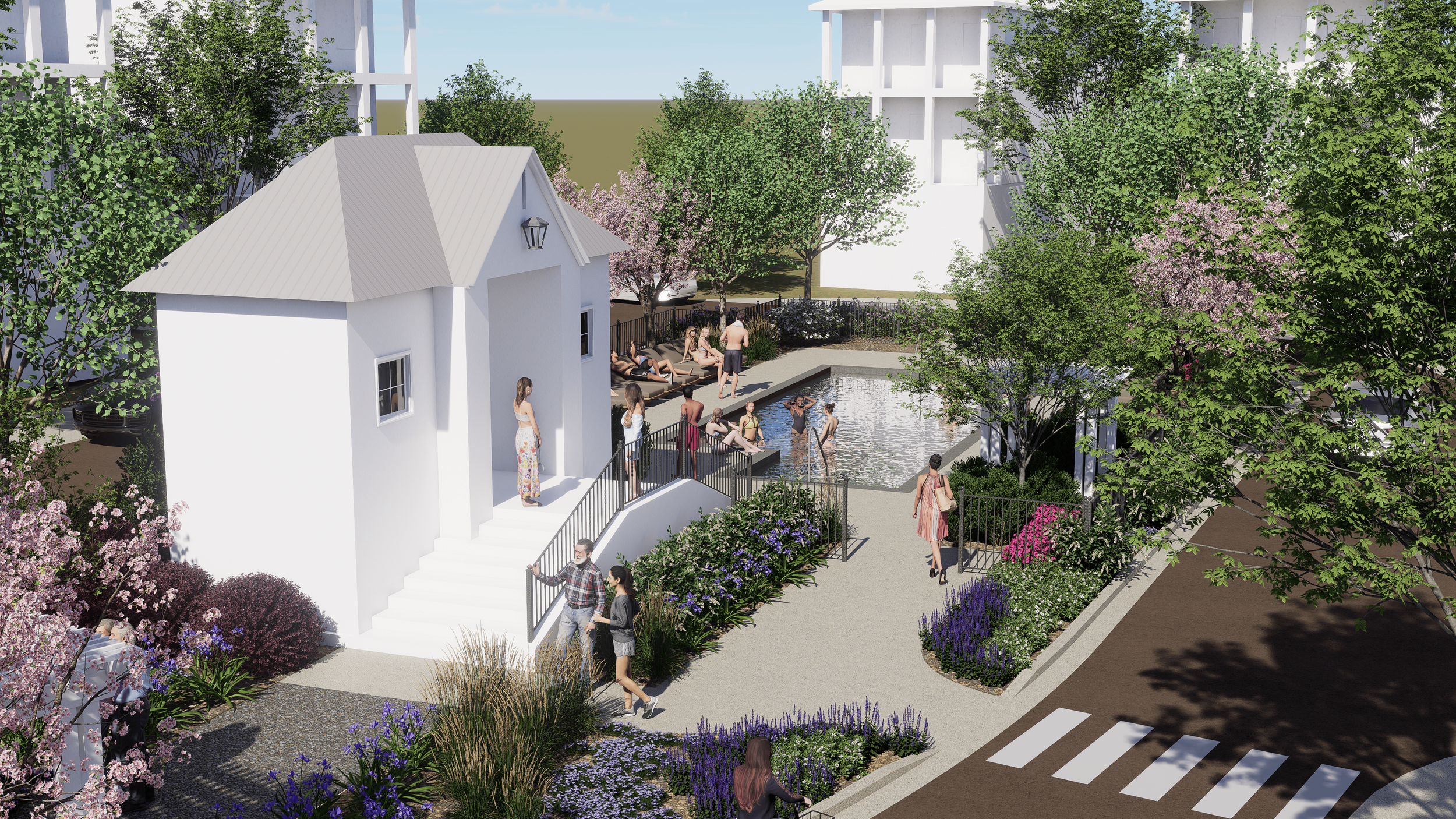 People swimming and relaxing by a community pool, surrounded by trees and landscaping, next to a white building with stairs and a fence.