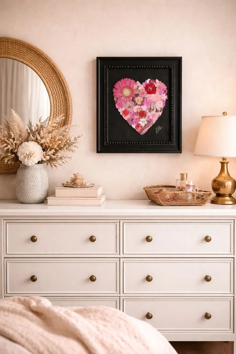 Pressed flower art in shape of pink and red heart