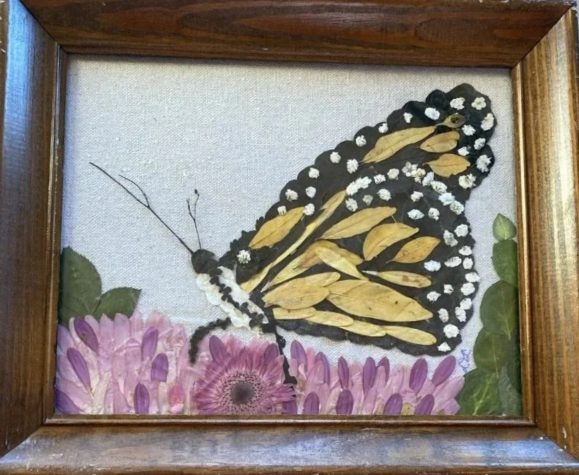 Pressed flower art of a butterfly handcrafted original of a kind art.