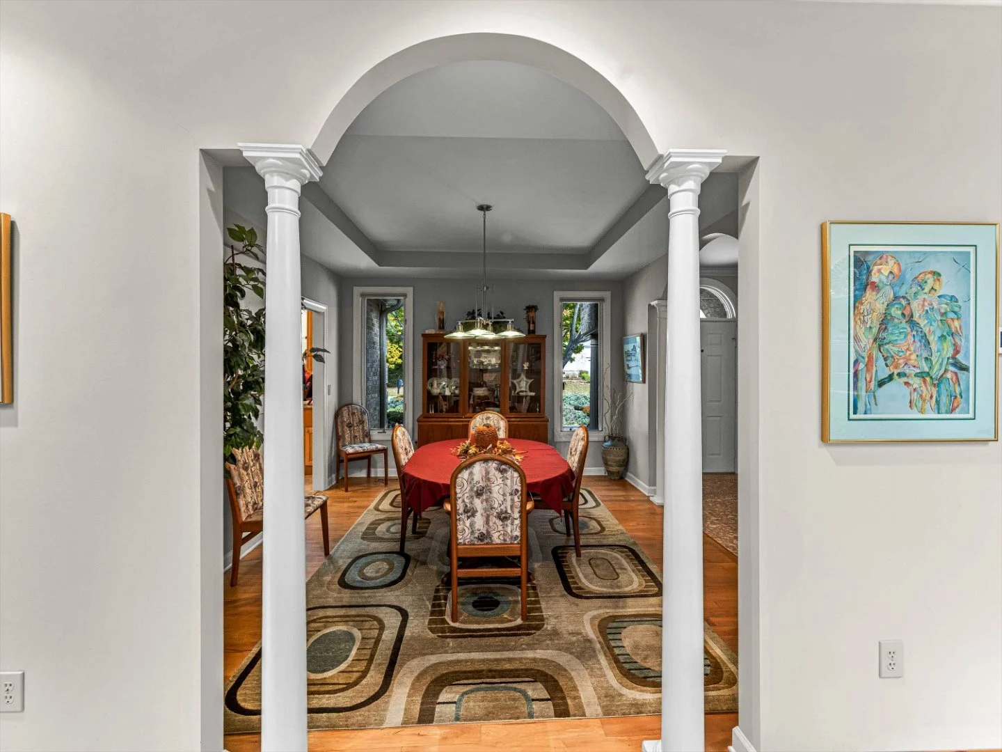 Carriage park dining room before remodel looking into doorway with and two slender columns enclosing dining room