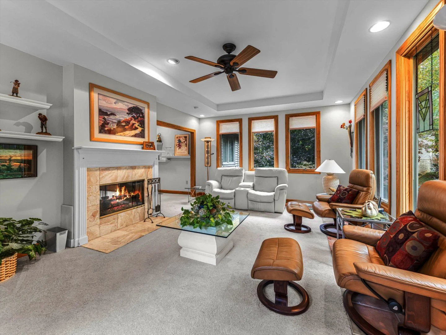 Carriage park home sunroom before remodel with white carpet, blonde wood trim around sun room windows, pink marble fireplace enclosed by extra wall