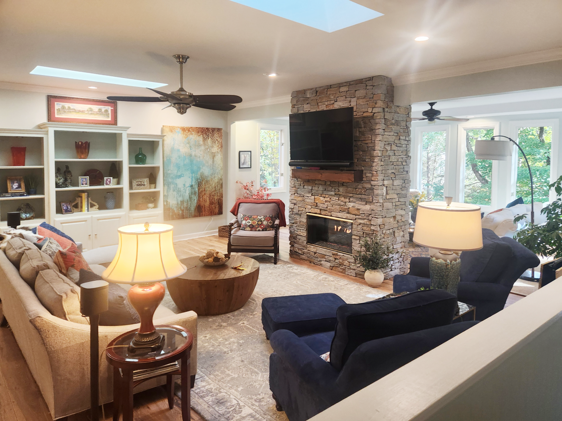 Redesigned floor-to-ceiling stone fireplace after Hendersonville NC home remodel