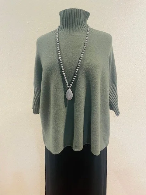 The Mock Neck Sweater from Orange, shown here in military, also comes in navy, burgundy and beige. One size.