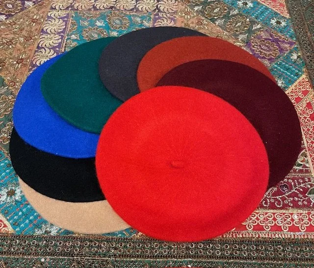 100% Wool Berets in assorted colors.