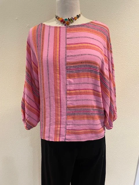 Tribal Boat Neck Dolman Sleeve Blouse in Rose Silk with the black Tribal Flare Pant with Smocking and necklace from Rain