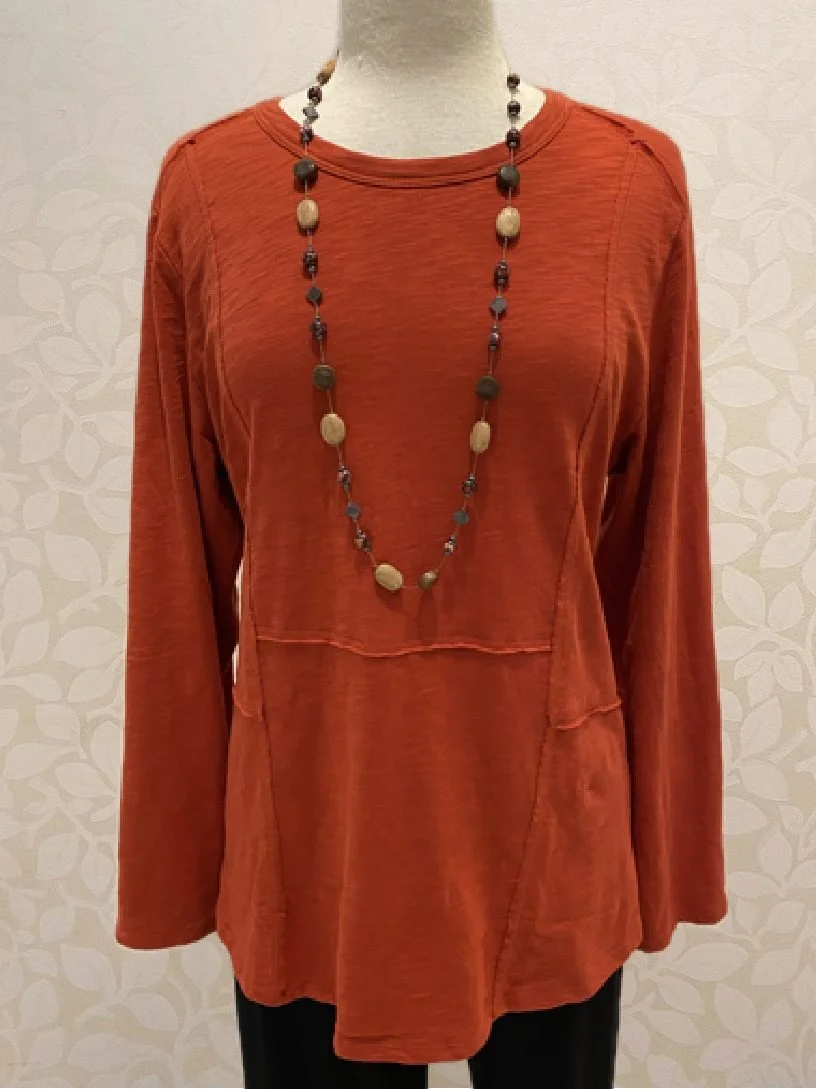 Cotton Pebble Shirttail Tunic from Habitat in rust. Also available in black, honey, lentil and teal.