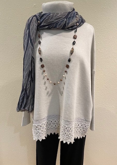 The Lace Edge Sweater in beige from Tempo Paris comes in sizes S/M and M/L.