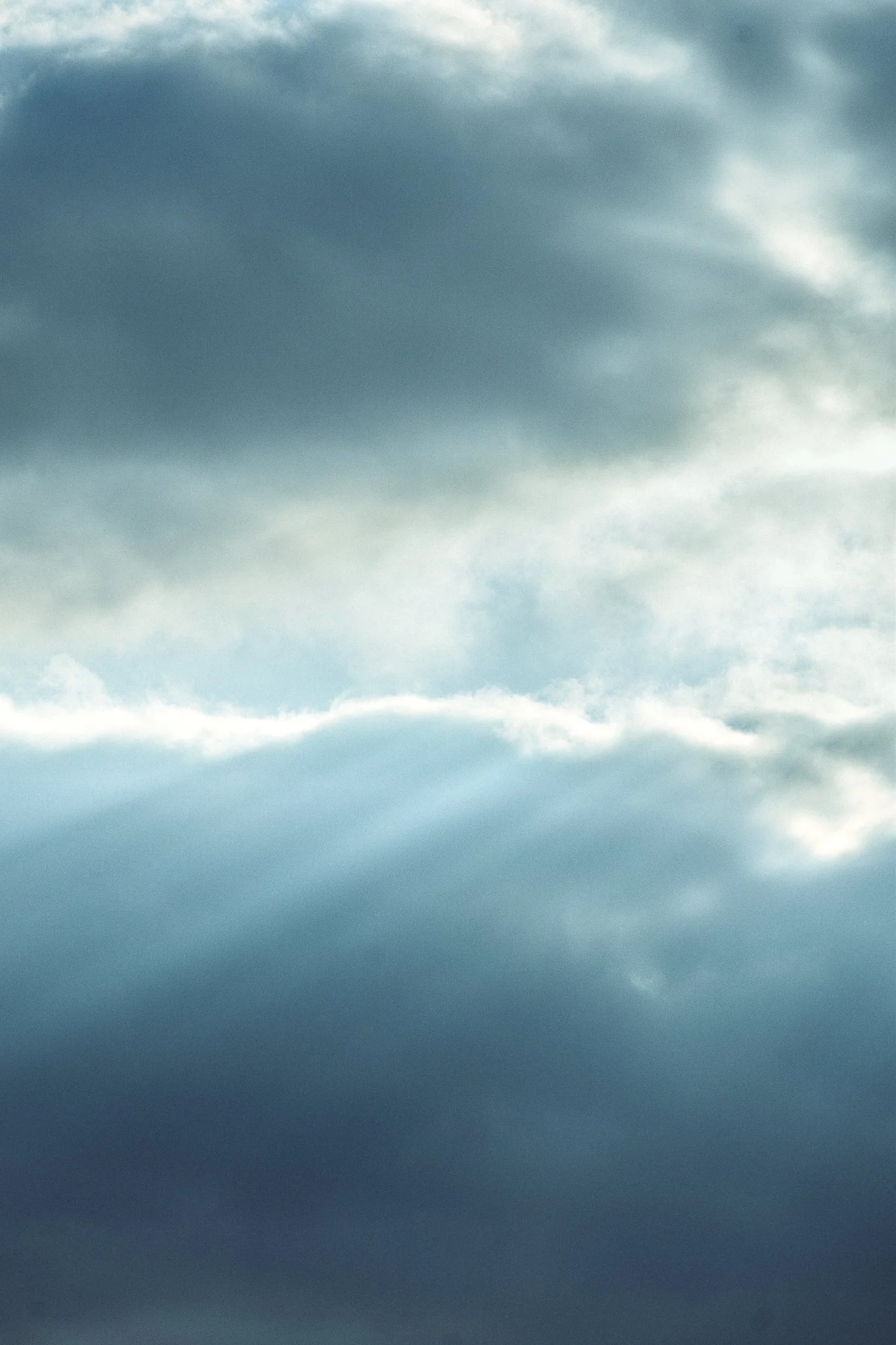 Overcast sky with dark and light clouds.
