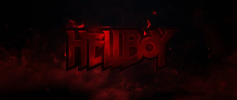 A dark background with red glowing letters spelling 'HELLBOY' in a stylized font.