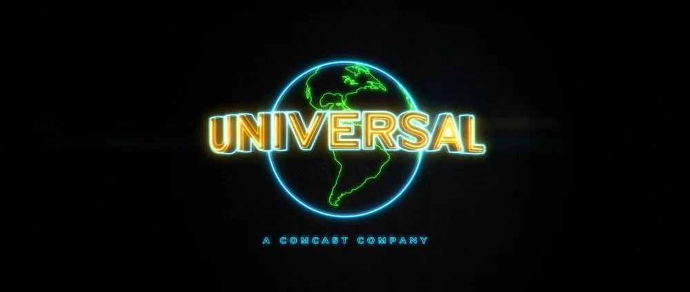 Neon-style logo with a globe outline behind the word 'UNIVERSAL' and smaller text 'A COMCAST COMPANY' below.