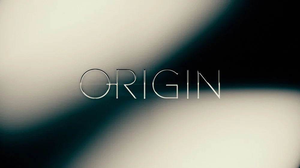 The word "ORIGIN" displayed on a gradient background with light and dark shades.