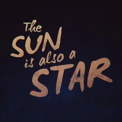 Inspirational quote saying 'The sun is also a star' on a dark background.