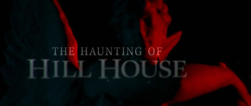 Title screen for 'The Haunting of Hill House' with dark background and red and blue abstract shapes.