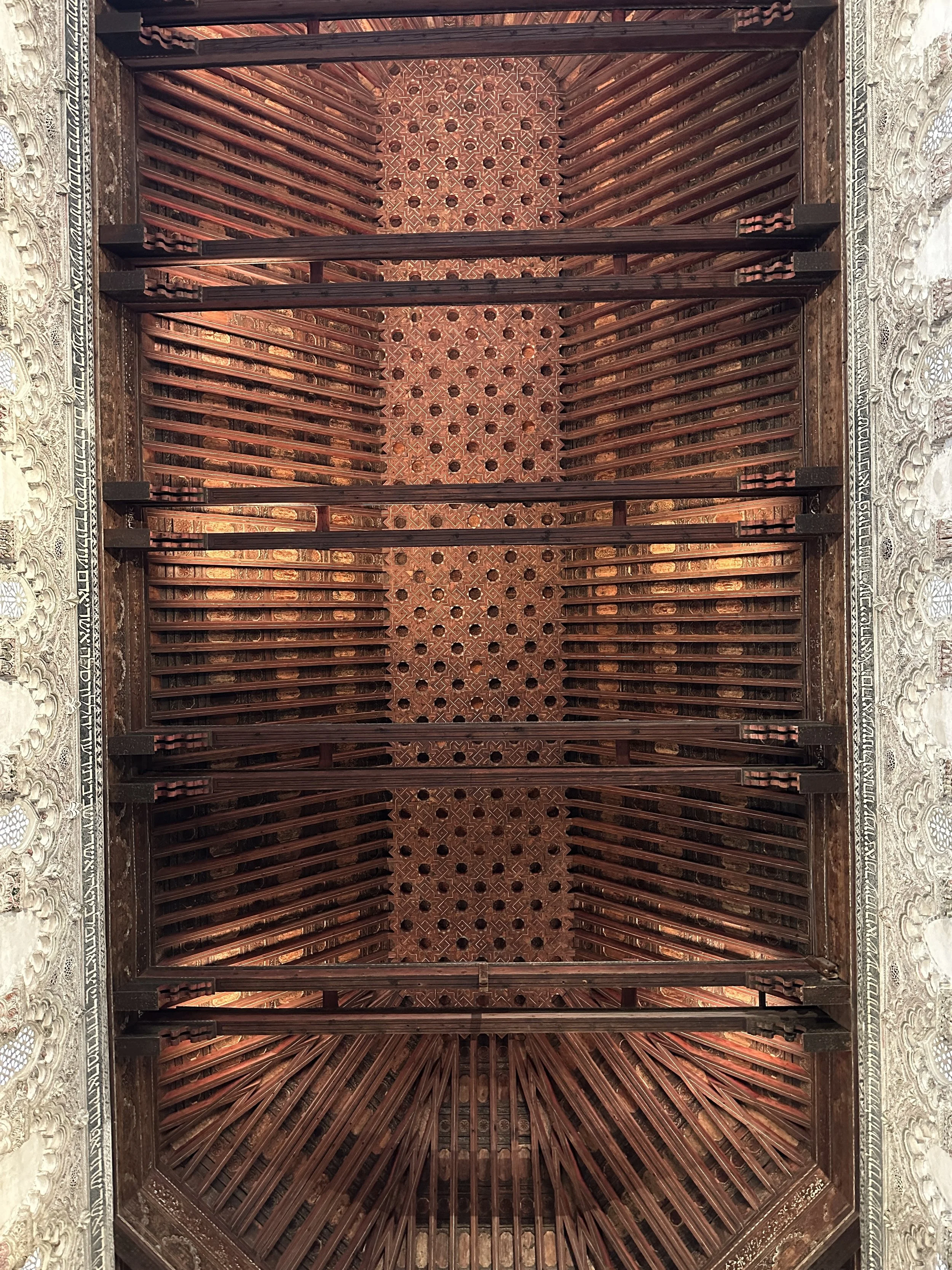  The ceiling is insane. It's a great example of these elaborate geometric wooden ceiling that were all the rage back then. 