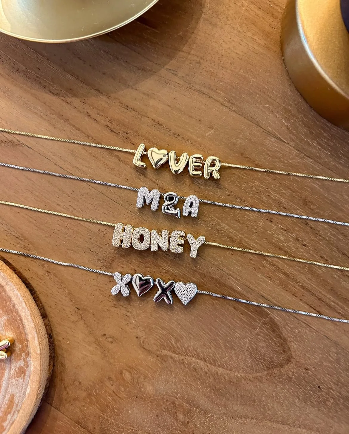 Personalized letter charms for custom necklaces and bracelets.