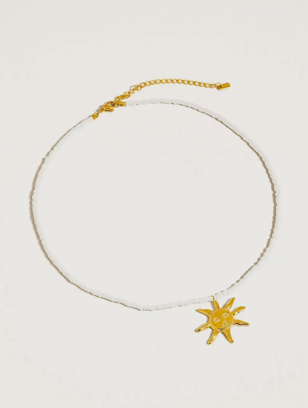 White beaded sun necklace