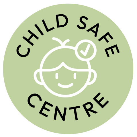 Child Safe Centre logo with a smiling child's face and a checkmark, on a light green circular background.