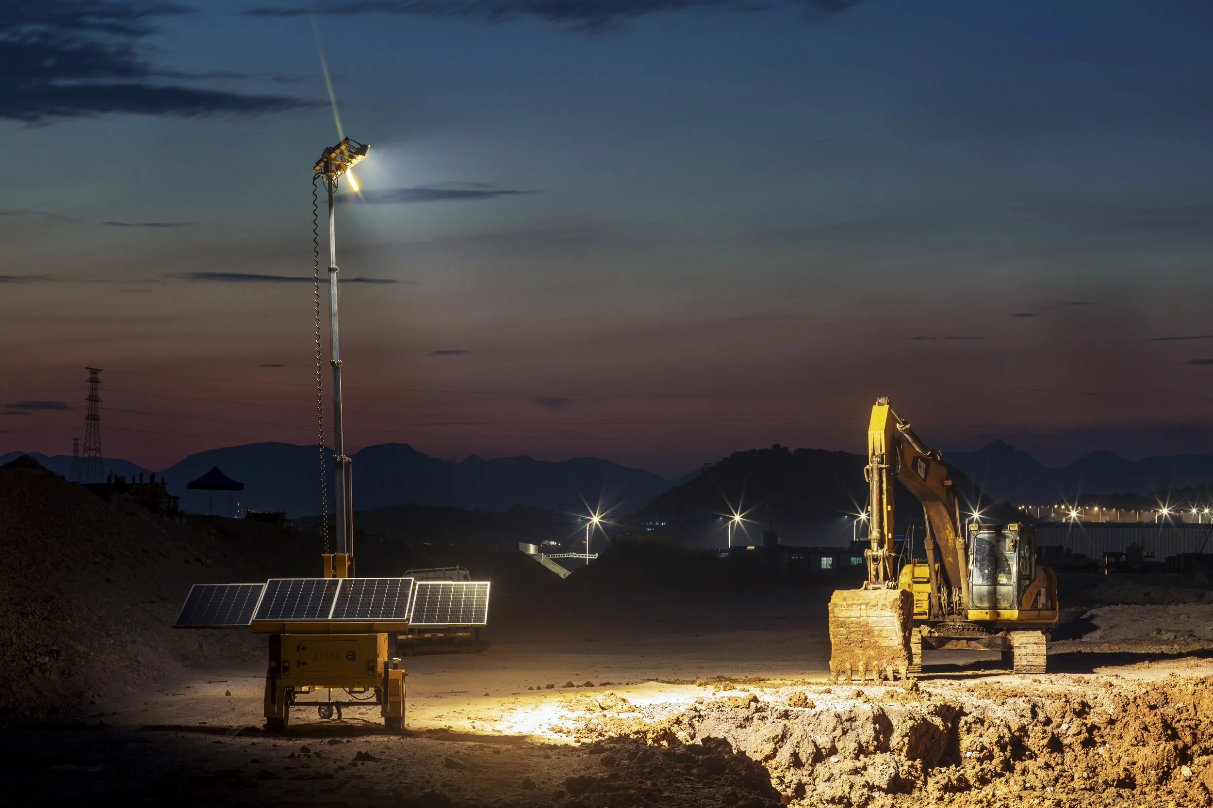 Outline of a solar panel mounted on a pole, illuminated at night, with a park background and park benches.