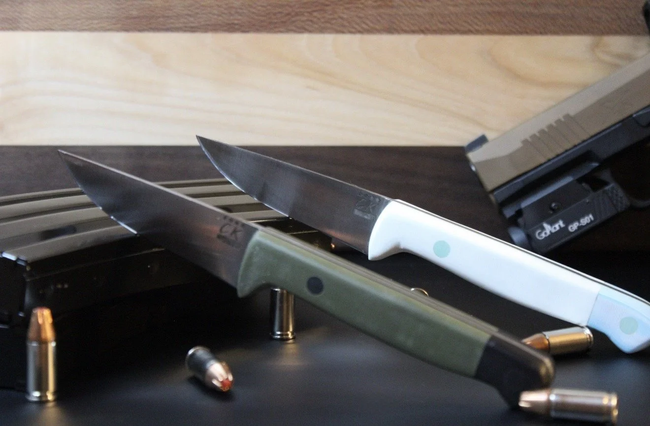 Two"Canyon's", one with a green/black handle and the other with a light blue/white handle