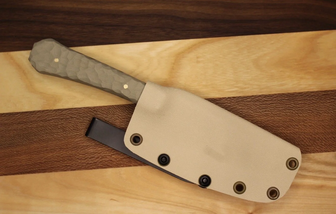 "Spartan" with rock texture handles, and tan kydex sheath